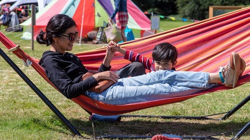 Mother & son relaxing in hammocks